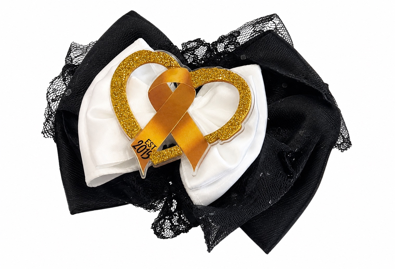 Close-up of the Whip Pediatric Cancer headband bow, showing the gold glitter heart and gold awareness ribbon over white satin and black tulle