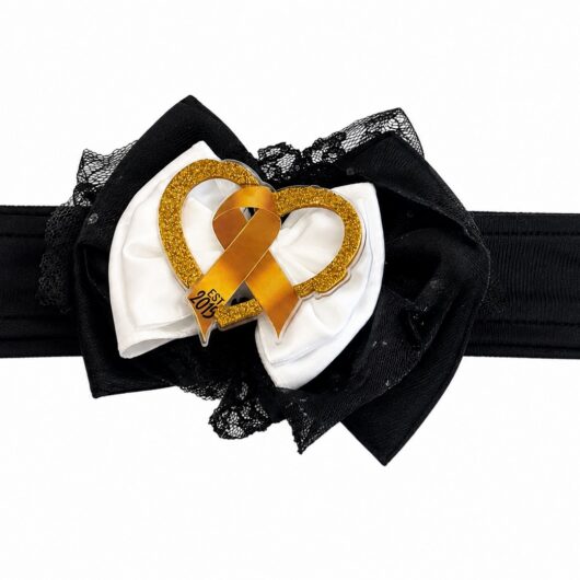 Whip Pediatric Cancer headband: soft black stretch band with a white satin and black tulle bow and a gold glitter heart with gold awareness ribbon
